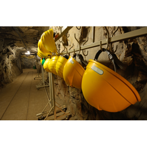 Image of hard hat helmets in a hazardous area with IECEx low-bay ceiling lights for mining & gas applications